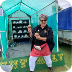 An EBS member stands in front of our crockery smash fundraising stall