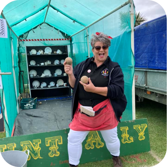 An EBS member stands in front of our crockery smash fundrasing stall