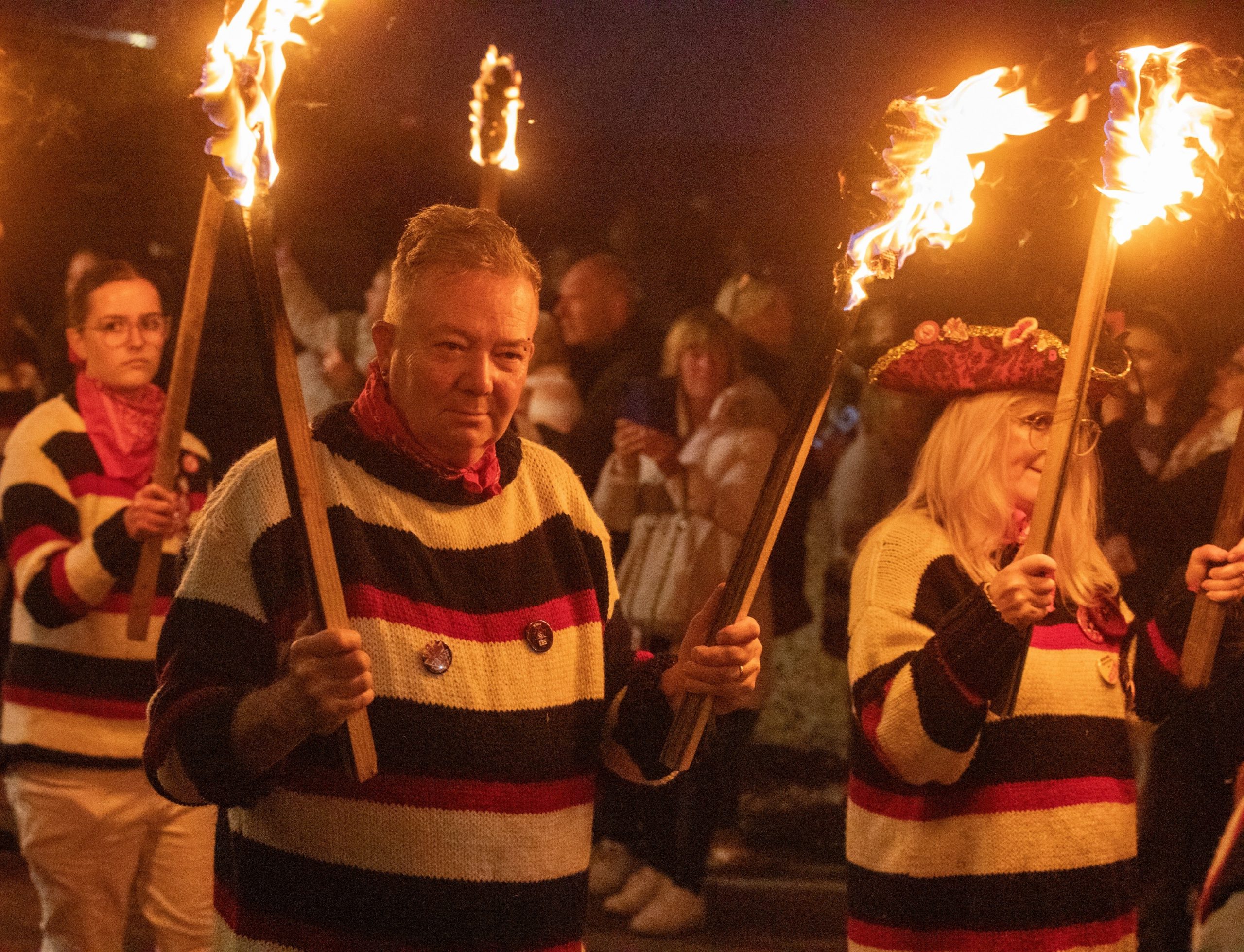 Eastbourne Bonfire Society members holding torches