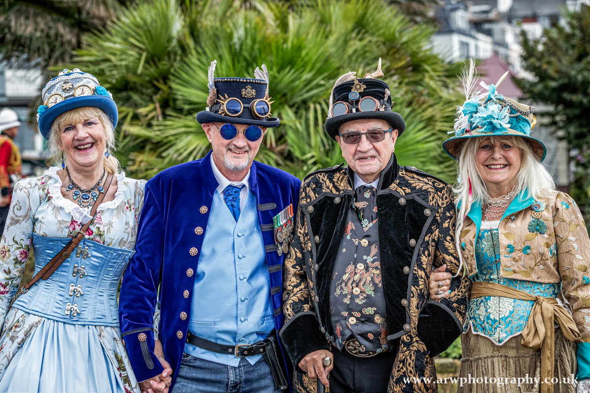 Group of 4 Steampunks in elegant outfits 